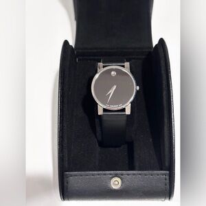 Movado 31mm Men's Black Dial Silver Case Watch with Black Leather Strap.